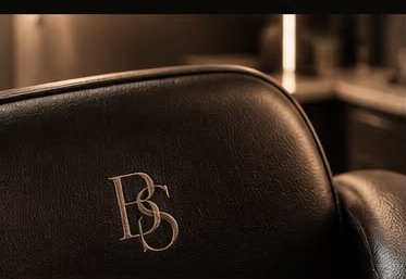 Close-up of the studio chair with an embossed BS monogram